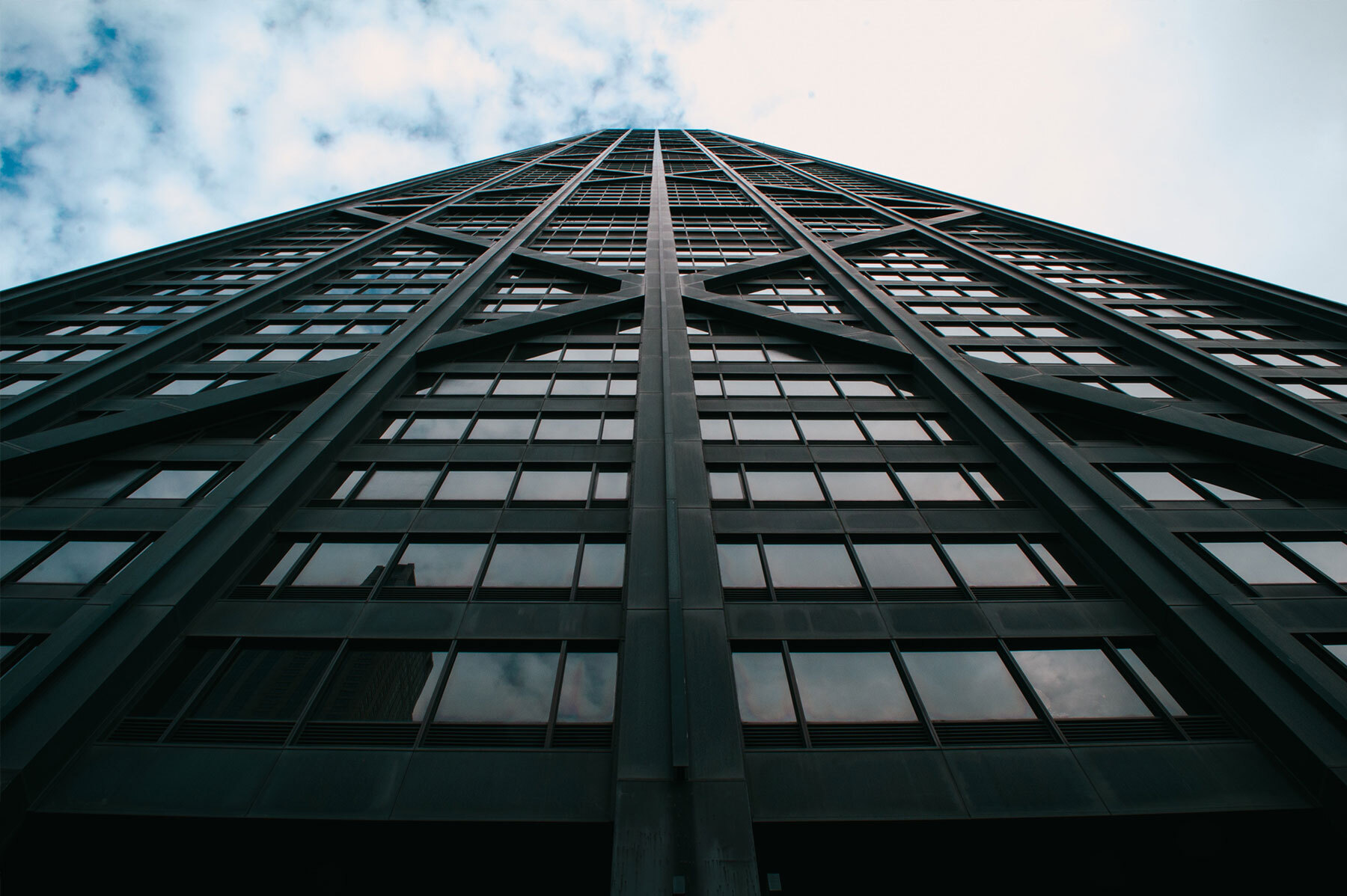 photo of skyscrapper captured from ground looking to sky