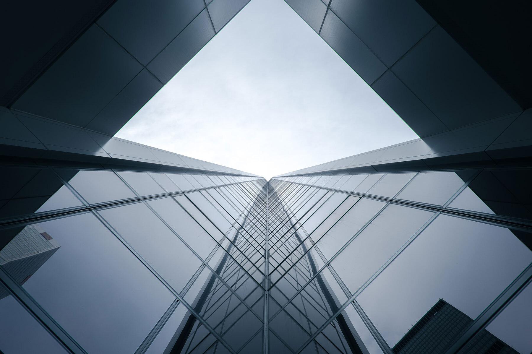 view of skyscraper from ground looking up