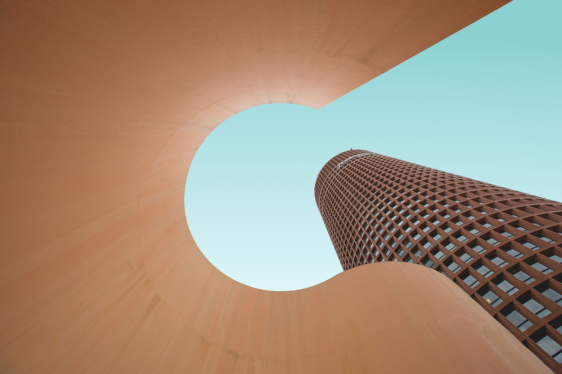 low angle shot of tan building creating keyhole shape