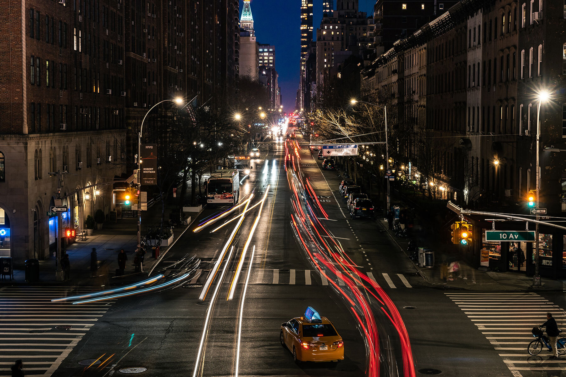 Timelapse photo of a busy intersection in New York City at night
